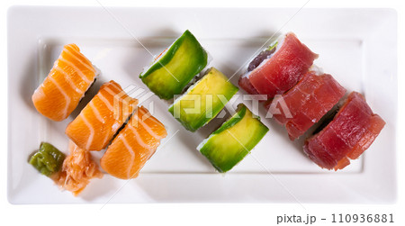 Delicious various sushi set served on plate. Sushi roll uramaki. Japanese food closeup 110936881