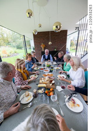 Communal Dining: Seniors Enjoying a Meal Together 110938263