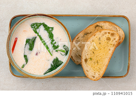 Portion of gourmet salmon creamy soup 110941015