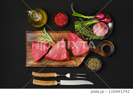 Overhead view of tri tip beef loin steak with spice and herbs 110941742