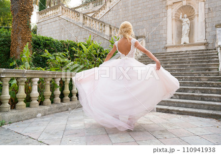 bride in a dress is spinning in a dance bride in a dress is spinning in a dance 110941938