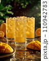 orange and orange juice in glass 110942783