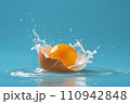fresh orange with water splash on blue background 110942848