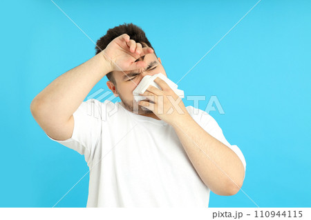 Upset overweight man on a blue background. Upset overweight man on a blue background. 110944115