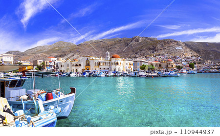 Scenic traditional greek isalnds. Kalymnos island in Dodecanese. Pothia town and harbor with fishing boats. Greece travel Scenic traditional greek isalnds. Kalymnos island in Dodecanese. Pothia town and harbor with fishing boats. Greece travel 110944937