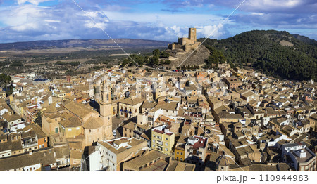 ancient Town Biar in Spain, Sierra de Mariola in the Vinalopo Valley in the province of Alicante . aerial drone view ancient Town Biar in Spain, Sierra de Mariola in the Vinalopo Valley in the province of Alicante . aerial drone view 110944983