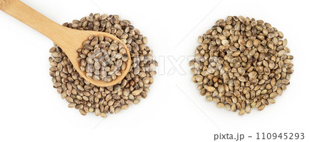 Hemp seeds in wooden spoon isolated on white background with full depth of field. Top view. Flat lay. Hemp seeds in wooden spoon isolated on white background with full depth of field. Top view. Flat lay. 110945293