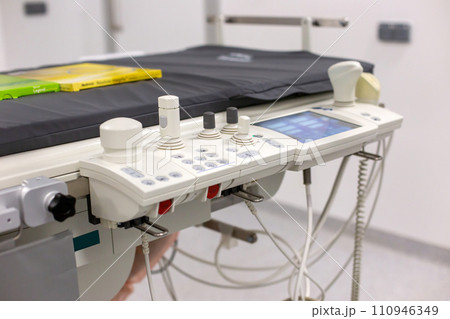Close-up of an ultrasound machine with probes in a clinical examination room 110946349