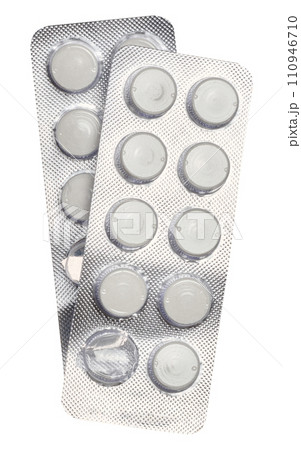Blister pack with round pills on a white isolated background, top view 110946710
