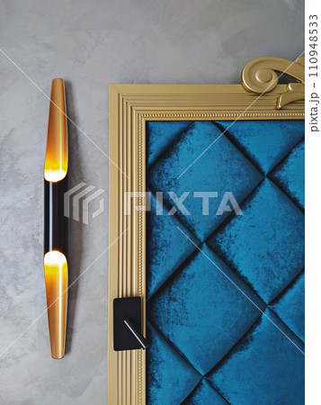 Modern sconces beside a blue padded velvet headboard and black switch Modern sconces beside a blue padded velvet headboard and black switch 110948533