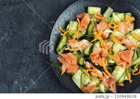 Salted salmon salad with green cucumber. 110948639