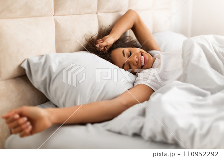 Happy Black Lady Waking Up After Well Sleep In Bedroom 110952292
