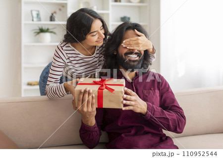 Cheerful indian couple celebrating birthday, anniversary at home 110952544