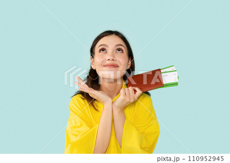 Cheerful Young Lady Holding Passport With Tickets 110952945