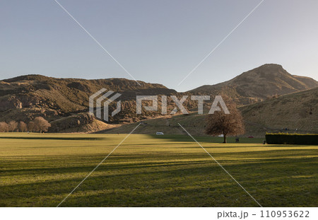 The breathtaking scenic landscape of Holyrood park with Salisbury Crags rugged hills and sky background. The breathtaking scenic landscape of Holyrood park with Salisbury Crags rugged hills and sky background. 110953622