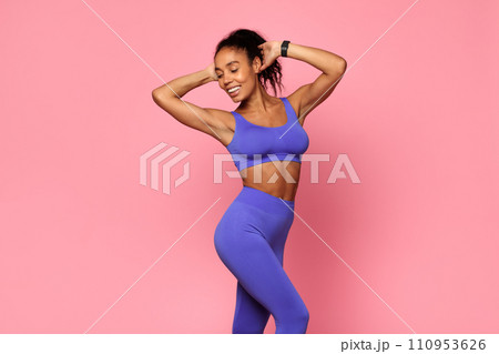 Fit Black Woman Wearing Sportswear Standing Over Pink Studio Backdrop 110953626