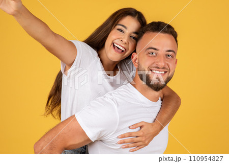 Glad millennial european lady in white t-shirts have fun, enjoy date, hugs, make selfie Glad millennial european lady in white t-shirts have fun, enjoy date, hugs, make selfie 110954827