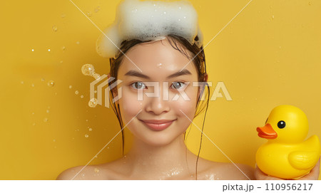 Young beautiful Asian woman washes her hair in the shower Young beautiful Asian woman washes her hair in the shower 110956217