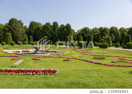 Flowerbed on the alley in the Schoenbrunn Palace Park 110956861