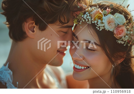 a couple and flowers crowns smiling together 110956918