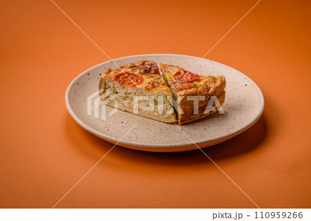 Delicious quiche with tomato, cheese, chicken, spices and herbs Delicious quiche with tomato, cheese, chicken, spices and herbs 110959266