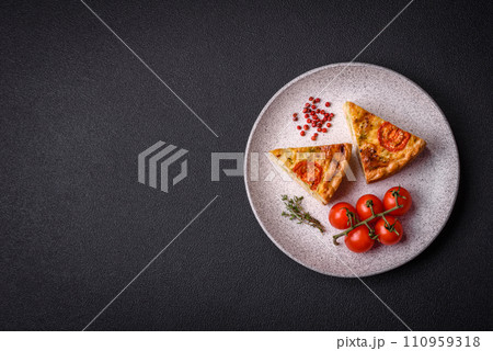 Delicious quiche with tomato, cheese, chicken, spices and herbs Delicious quiche with tomato, cheese, chicken, spices and herbs 110959318