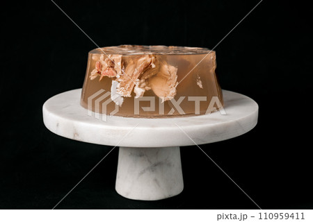 Jelly with meat, beef aspic, traditional dish. portion on plate. 110959411