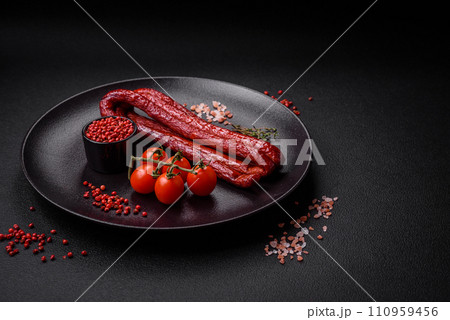 Delicious thin smoked hunting sausages with salt, spices and herbs Delicious thin smoked hunting sausages with salt, spices and herbs 110959456