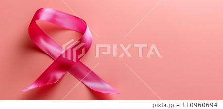 Breast cancer awareness month symbol  pink ribbon isolated on pink background with copy space 110960694