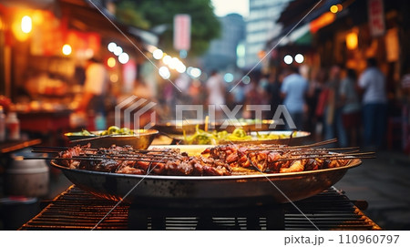 Colorful and bustling street food market with vibrant offerings under bright lighting. Colorful and bustling street food market with vibrant offerings under bright lighting. 110960797