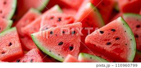 Vibrant and refreshing macro close up of juicy and freshly sliced watermelon wedges, top view 110960799