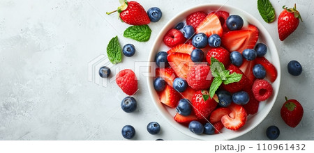 Top view of healthy oatmeal porridge with berries on white table, copy space for text Top view of healthy oatmeal porridge with berries on white table, copy space for text 110961432