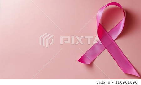 Breast cancer awareness symbol with pink ribbon on vibrant pink background, supporting the cause. Breast cancer awareness symbol with pink ribbon on vibrant pink background, supporting the cause. 110961896
