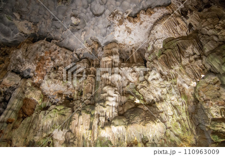 Beautiful flowstone and stalactites in Thien Cung Cave (Heavenly Palace Cave) of Halong Bay, Vietnam. Thien Cung Cave is one of the largest and most beautiful caves in Halong Bay. Beautiful flowstone and stalactites in Thien Cung Cave (Heavenly Palace Cave) of Halong Bay, Vietnam. Thien Cung Cave is one of the largest and most beautiful caves in Halong Bay. 110963009