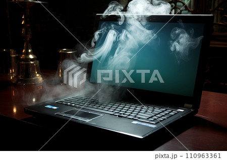 Intense flames and grey smoke engulfing laptop on dark background, 70  of image. 110963361