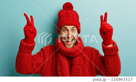 Cheerful man wearing a scarf and knitted hat, isolated on a pastel background with room for text Cheerful man wearing a scarf and knitted hat, isolated on a pastel background with room for text 110963517