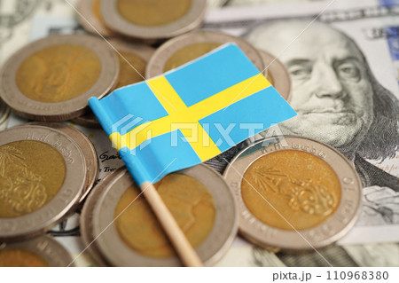 Sweden flag on coins background, finance and accounting, banking concept. Sweden flag on coins background, finance and accounting, banking concept. 110968380