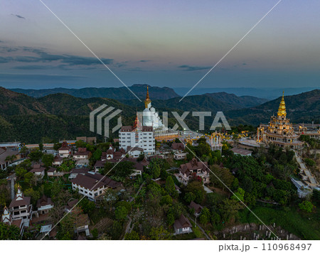 .Aerial view White buddha in Wat Phra That Pha Son Kaew temple at sunset. 110968497