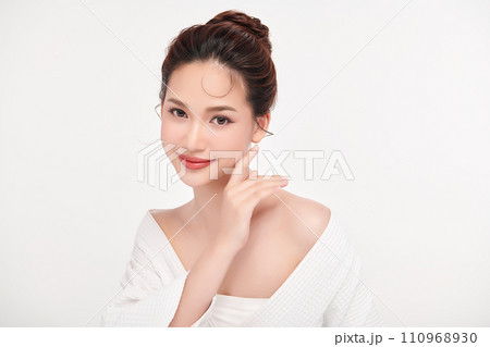 Beautiful young asian woman with clean fresh skin on white background, Face care, Facial treatment, Cosmetology, beauty and spa, Asian women portrait. Beautiful young asian woman with clean fresh skin on white background, Face care, Facial treatment, Cosmetology, beauty and spa, Asian women portrait. 110968930