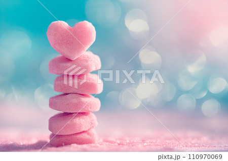 Closeup of pink candy hearts and sweets in shape of love symbol on pink background, for Valentine's day Closeup of pink candy hearts and sweets in shape of love symbol on pink background, for Valentine's day 110970069