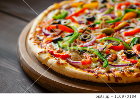 Delicious Vegetarian Pizza with Colorful Bell Peppers, Olives, and Onions Delicious Vegetarian Pizza with Colorful Bell Peppers, Olives, and Onions 110970184