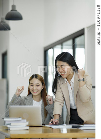 Excited Businesswomen Celebrating Success at Work. Excited Businesswomen Celebrating Success at Work. 110971129