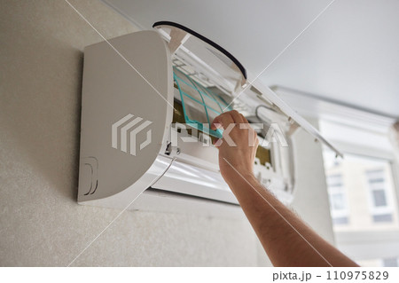 Dirty air conditioner filter need cleaning. Air conditioner service, repair and clean equipment. 110975829