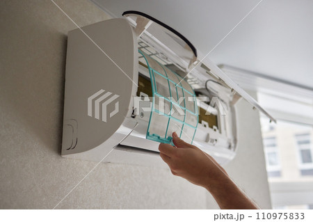 Dirty air conditioner filter need cleaning. Air conditioner service, repair and clean equipment. 110975833