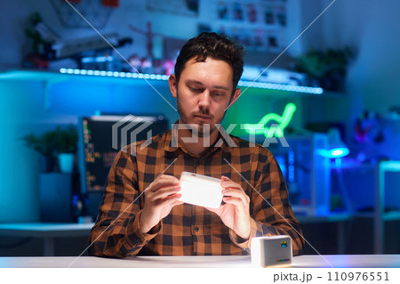 Compact, portable mini LED lamp isolated on a bright background. Compact, portable mini LED lamp isolated on a bright background. 110976551