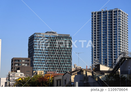 Busy city street with tall skyscrapers and urban architecture Nov 29 2023 Busy city street with tall skyscrapers and urban architecture Nov 29 2023 110978604