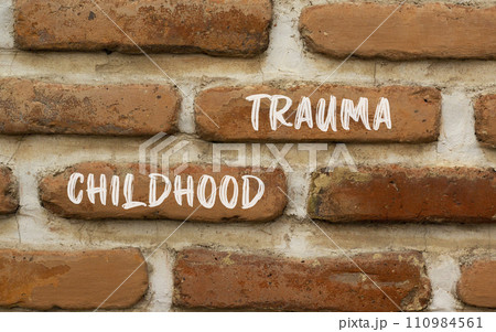 Childhood trauma symbol. Concept words Childhood trauma on beautiful brick wall. Beautiful red brown brick wall background. Business psychology childhood trauma concept. Copy space. Childhood trauma symbol. Concept words Childhood trauma on beautiful brick wall. Beautiful red brown brick wall background. Business psychology childhood trauma concept. Copy space. 110984561