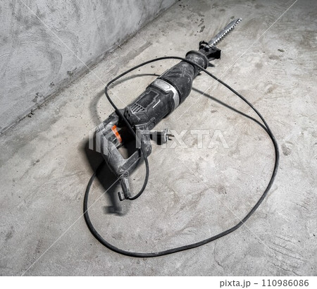 Perforator at construction site. Puncher, power drill, building tool Perforator at construction site. Puncher, power drill, building tool 110986086