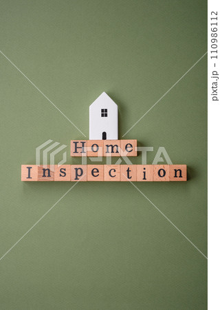 The inscription Home inspection made of wooden cubes on a plain background 110986112