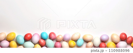 Top view of Easter eggs dyed in different colors on white background. Easter banner 110988096